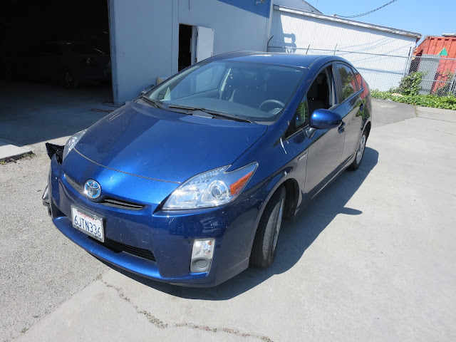 Prius with collision damage before repairs at Almost Everything Auto Body