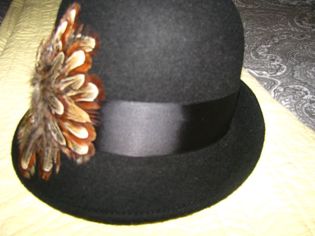 cloche hat with feather detail