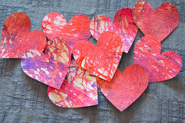 Valentine's Day Marble Painted Hearts and Valentine Garland- fun and easy painting process art activity for Valentine's Day. Great for preschool, kindergarten, or elementary kids. Leave as is or string into a pretty garland for decoration!