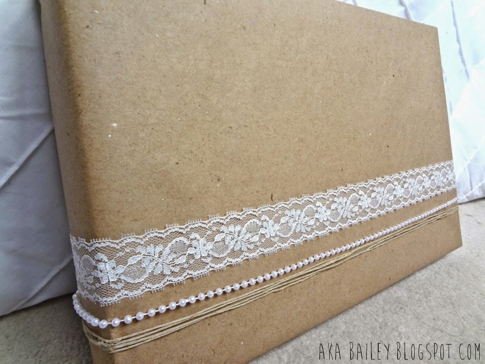 Brown paper gift wrap with lace, pearl and hemp