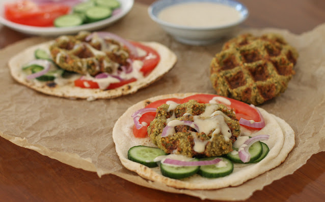 Food Lust People Love: Waffled falafel sandwiches are made by cooking your homemade falafel mix in a lightly oiled waffle iron which gets the falafels crispy outside and fluffy inside without frying. Stuff them in flatbread, drizzled with tahini sauce.