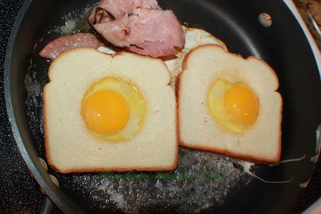 This is a famous egg breakfast usually called toad in a hole, egg in a hole, birds in a nest. It is a slice of bread with the middle cut out and a poached egg in the center