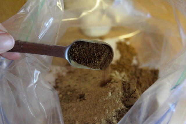 Ground clove being added to the resealable bag. 
