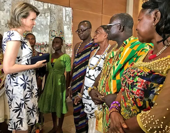 Queen Mathilde wore Natan floral print dress, Natan shoes an carried Natan clutch for visit Televic e-lab, SDGs and Unicorne Siona in Ghana