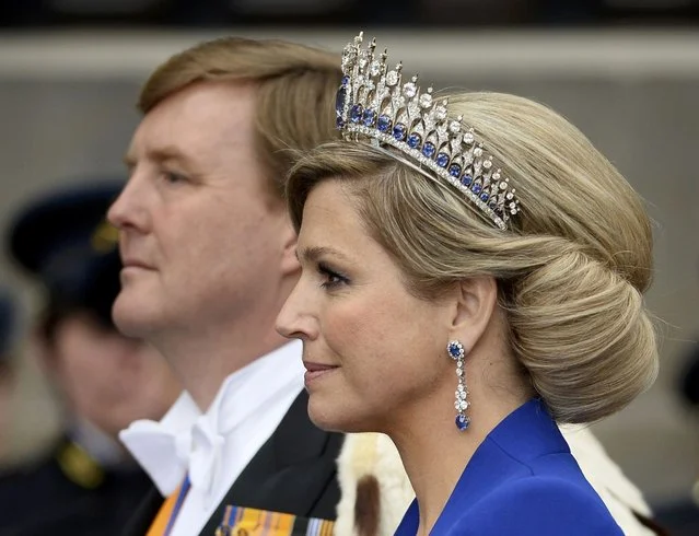 Dutch King Willem-Alexander is given three cheers by guests and his wife Queen Maxima inside the Nieuwe Kerk or New Church