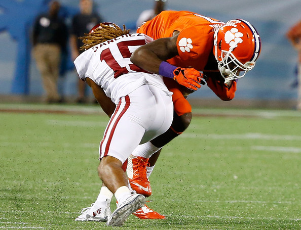 Mike Williams #7 of the Clemson Tigers is tackled by Zack Sanchez #15 of the Oklahoma Sooners during the Russell Athletic Bowl at Florida Citrus Bowl on December 29, 2014 in Orlando, Florida.