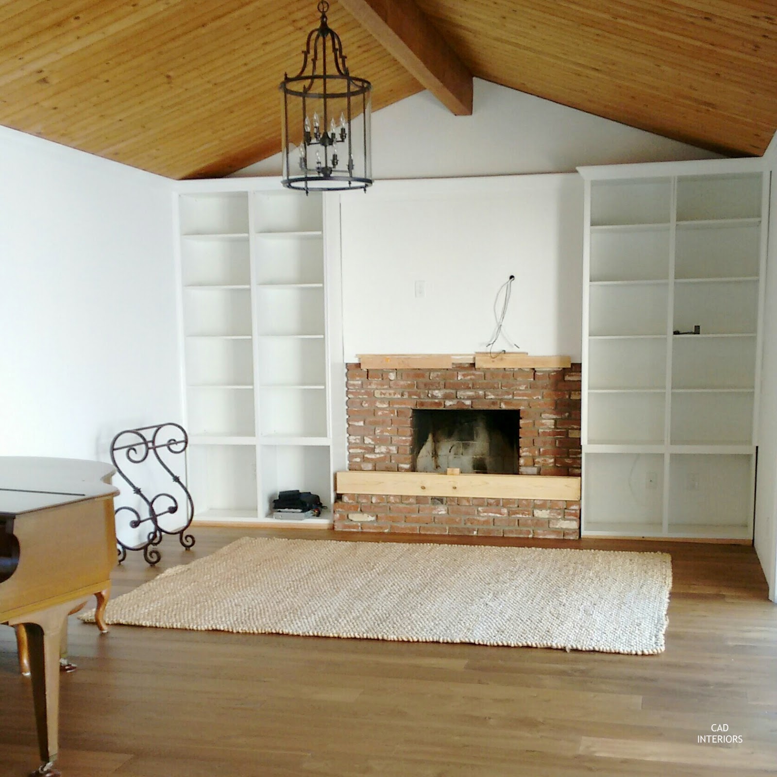 Ikea built-ins white walls natural woven texture jute rug european oak wide plank floors