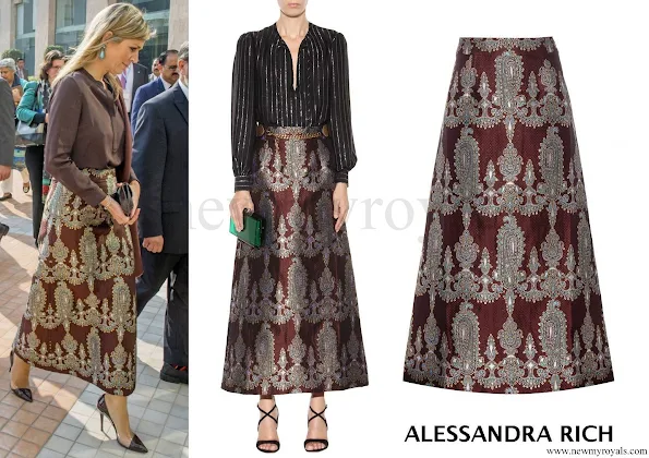 the Queen wore a printed silk blend skirt by ALESSANDRA RICH which is a London outfit brand. The printed silk blend skirt retails for 825.00 € with 40 percent discount on MYTHERESA website