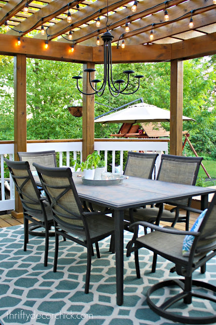 Pergola on deck with table and chairs
