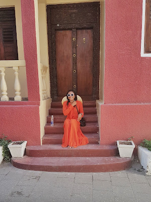 Summer Vacation Diaries - Touring Stone Town, Zanzibar by fashion and lifestyle blogger dafashionfreak. breezy orange maxi dress for summer