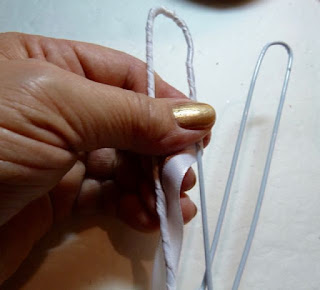 Recycled wire hanger back scratcher