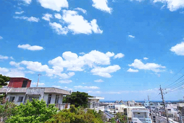 Scene on a sunny day in Kin Town, GIF