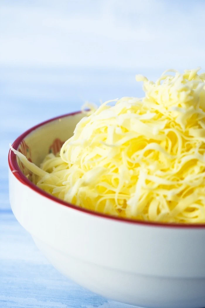 Bowl of grated cheddar