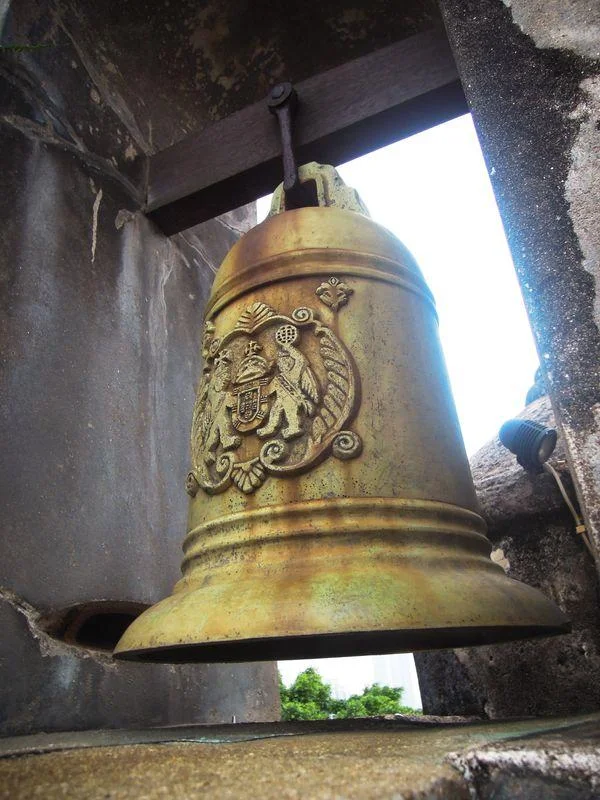 A bell hanging on the wall of Fortaleza do Monte in Macau