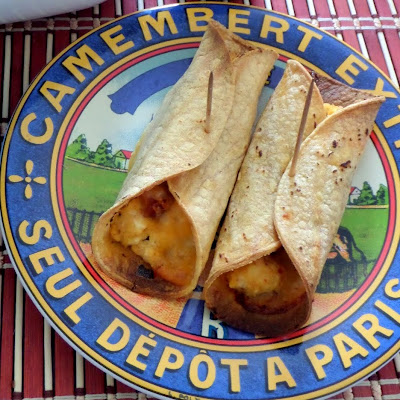 Baked Breakfast Taquitos:  Corn tortillas filled with scrambled eggs, bacon and cheese then baked until crunchy.