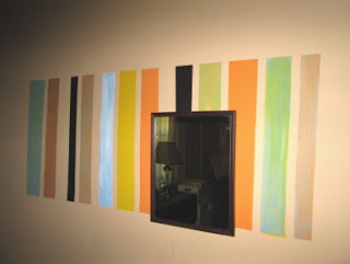 multicolor stripes on a wall mirror