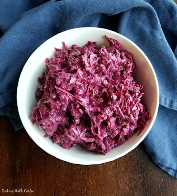 Russian Style Beet Salad is the perfect combination of creamy and crunchy, savory and sweet. You just have to try it! bowl of shredded beet salad