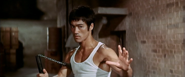Bruce Lee with nunchucks in Way of the Dragon