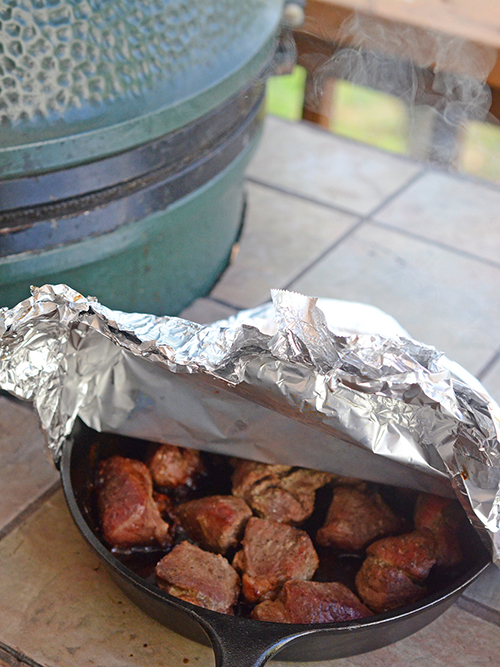 Smithfield Seasoned Carnitas cooked in cast iron on a Big Green Egg kamado grill