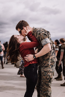 Marine and Wife reuniting at their homecoming after a long deployment at Marine Core Air Station Miramar with VMFA 225 by Morning Owl Fine Art photography San Diego.