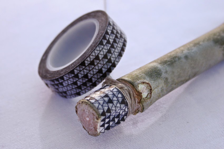 Atar hilo bala en la rama para hacer el diy arco de indio2