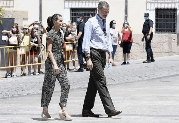 The Queen wore a new bow-detail jumpsuit by Mango. Queen Letizia wore Mango bow detail jumpsuit, gold earrings