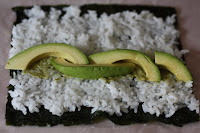 open peanut avocado sushi roll before rolling