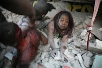 A Haitian woman is covered in rubble in Port-au-Prince after a huge earthquake measuring 7.0 rocked the impoverished Caribbean nation, toppling buildings and causing widespread damage and panic, officials and AFP witnesses said.(AFP/Lisandro Suero)
