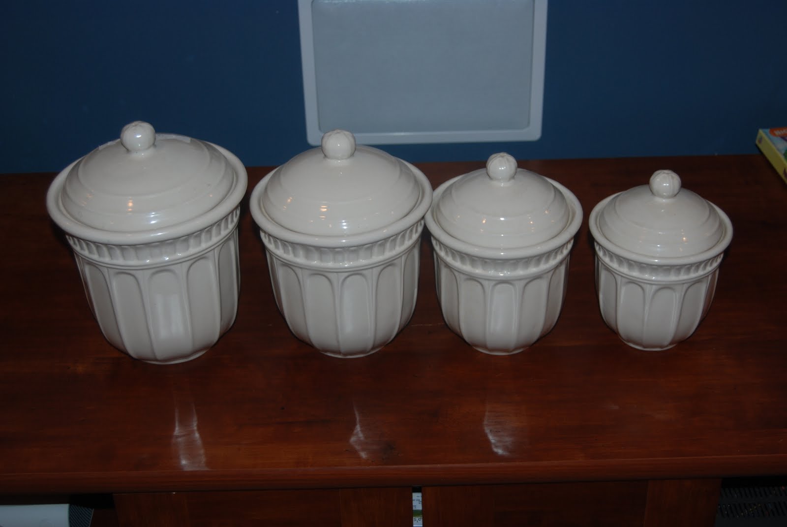 The Delp's "Yard sale" 4 piece canister set cream