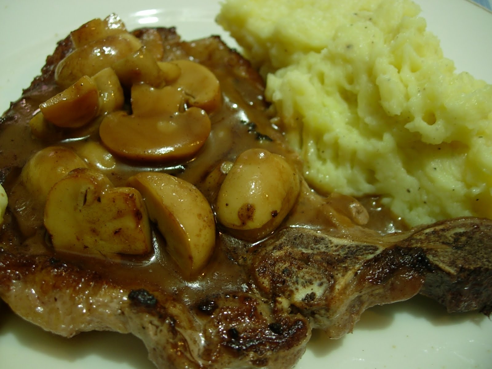 Lia's Food Journey TBone with mushrooms and mashed potatoes