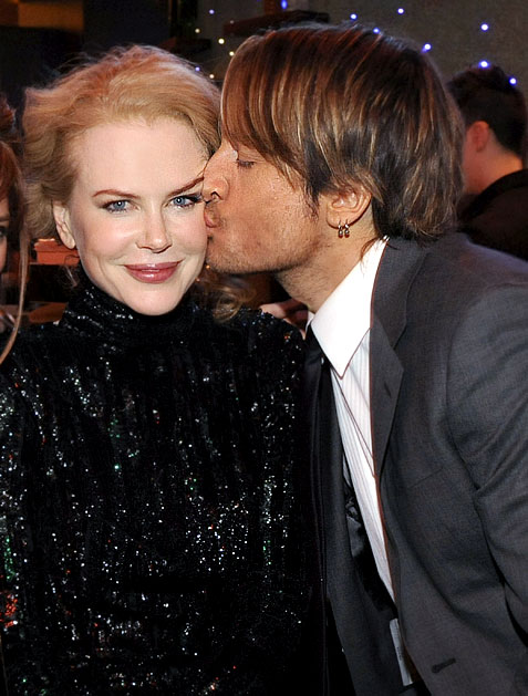 Keith Urban kisses wife Nicole Kidman at a Capitol Records ACM bash in Las 