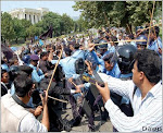 ISLAMABAD - Sept 4: Photographers grab the scene of clash between protesting lawyers and police out