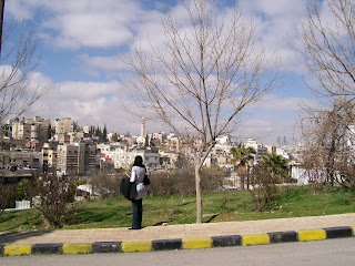 An Iraqi student overlooking the densely-populated urban landscape in East Amman, Jordan. [photo: Emily Stivers, 2-28-08]