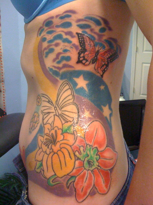 women tattoo: Flower Butterfly Tattoos - A Sexy and Meaningful Tattoo