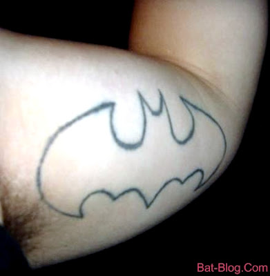 batman symbol arm tattoos