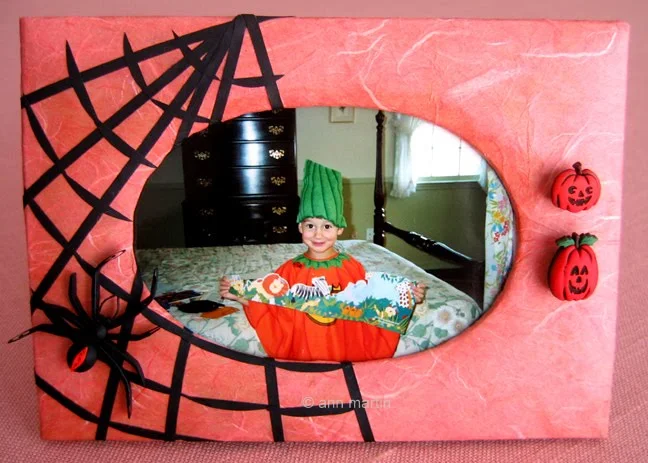 quilled black widow spider and web on photo frame