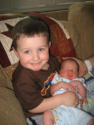 Harrison meeting Charlie for the first time- he's a great big brother