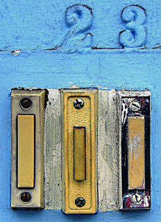 Photograph of the number 23 above some doorbells