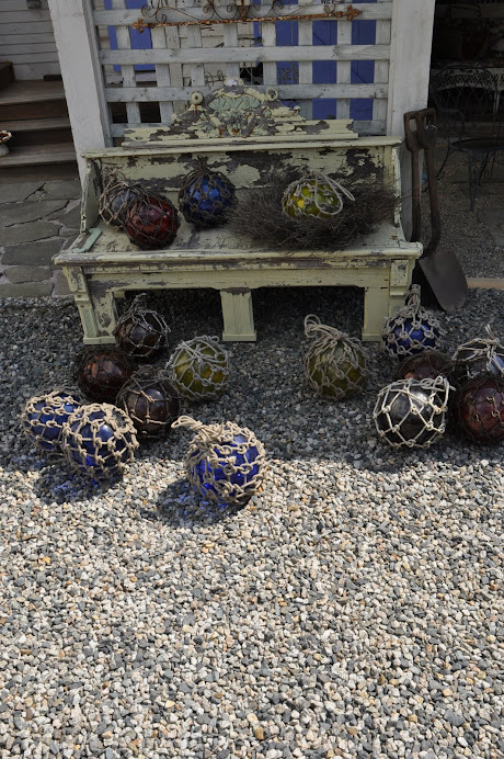 OLD GLASS FISHERMANS BOUYS, TAKE THE NET OFF, THEY MAKE GREAT ART INDOORS OR OUT. TRY IT !