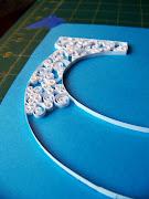 Simple white quilling on a blue background. I'm really enjoying this project .