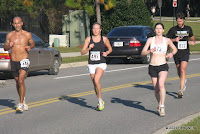 #492 Amy Hines and #872 Sheryl Rosen were still running closely together halfway through the 15K.