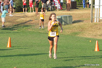 Rebecca Clendinen heading to finish line ahead of Lindsay Hughes.