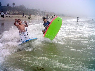 Aloha Beach Camp kids on thir boogie board enjoying the Malibu waves