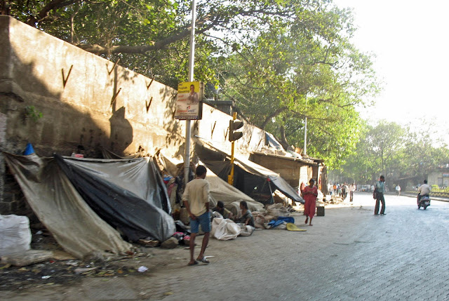 tents on pavement by homeless