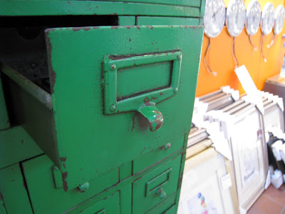 Drawer in a vintage green steel card file cabinet