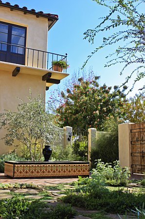 Courtyard in a Cheviot Hills home after remodeling with a tiled fountain
