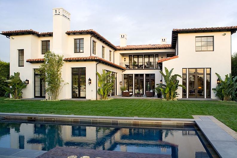 Backyard with a large pool in a Spanish revival style home in Los Angeles