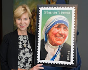 Standing with the unveiled Mother Teresa stamp!