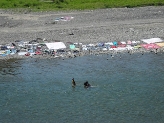 Washing clothes in the river