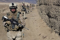 Marines patrol for insurgents in Afghanistan's Helmand province last month. Secretary of Defense Robert Gates has said the military in Afghanistan will focus on concrete, short-term goals.